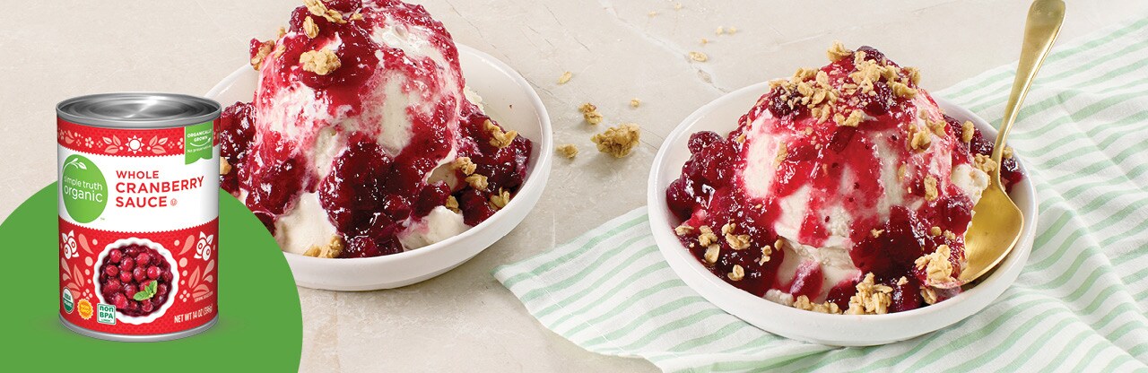 Bowls of vanilla ice cream topped with cranberry sauce and granola