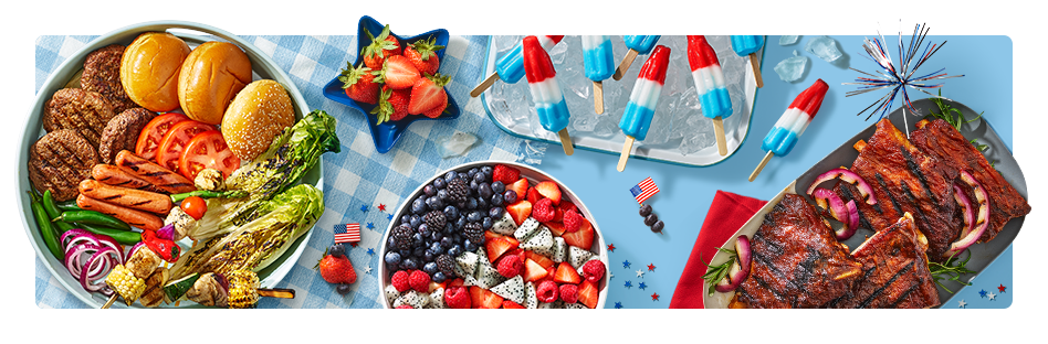 Platter of grilled hotdogs, hamburgers and vegetables, a delicious rack of grilled ribs, red white & blue popsicles, and plates of fresh berries.