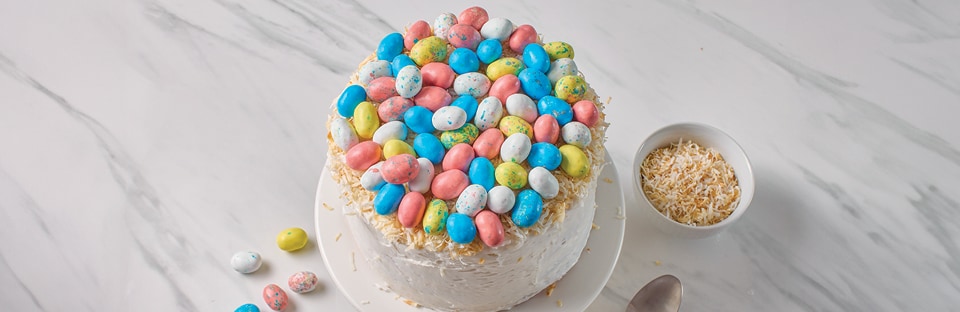 Assorted candy eggs on cake