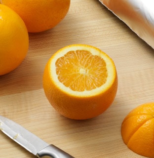 Slice the tops off the oranges