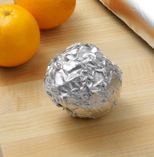 Wrap each orange in aluminum