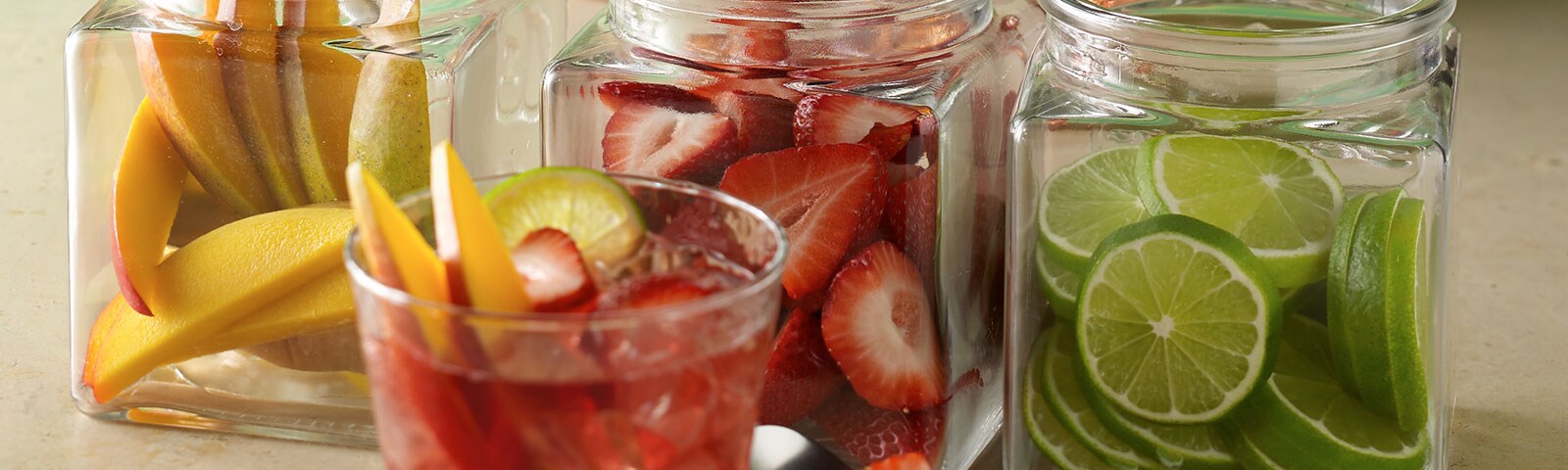 Strawberries and lime in a glass with ice
