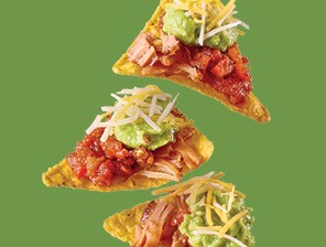 Nachos with carnitas, salsa, guaca-mole and shredded cheese