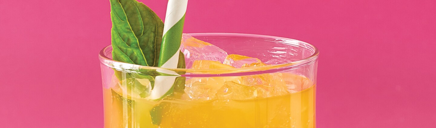 closeup of cocktail glass with pineapple surprise drink