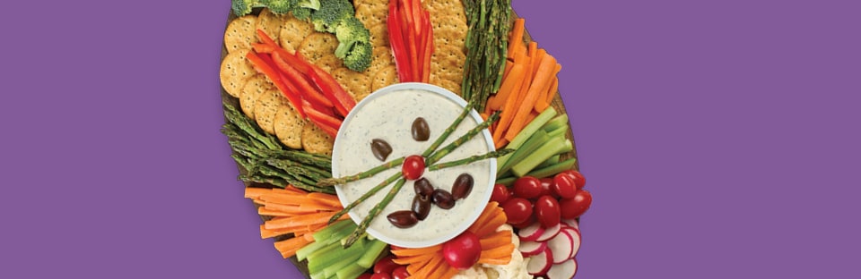 veggie tray with items arranged in the shape of a bunny head