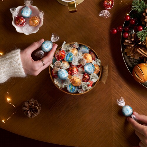 Lindt LINDOR Holiday Assortment Chocolate Christmas Candy Truffles Bag Perspective: back