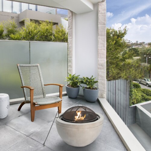 Teamson Home Outdoor Round BBQ Grill Wood Burning Fire Pit with Fireplace Poker Perspective: back
