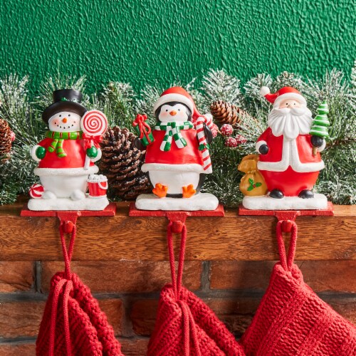 Glitzhome 6.5 Inch Tall Set of Three Resin Santa, Snowman, Penguin Stocking Holder Perspective: back