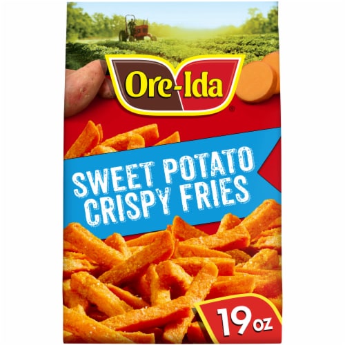 bags of Ore Ida brand frozen french fries in the freezer section