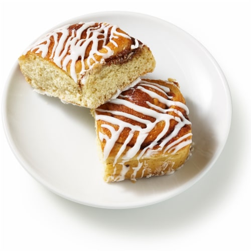 Bakery Fresh Cinnamon Rolls With Drizzled White Icing Perspective: left