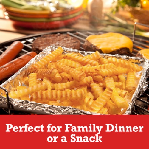 Ore-Ida Extra Crispy Seasoned Crinkles French Fries Fried Frozen Potatoes Perspective: left