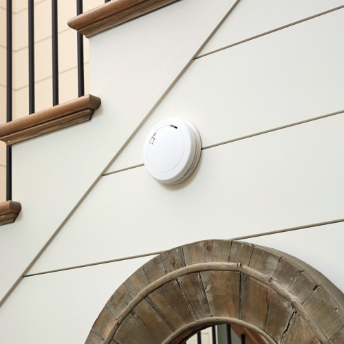 First Alert™ Sealed Battery Photoelectric Slim Round Smoke Alarm Perspective: left