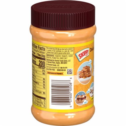 Skippy® Natural Creamy Peanut Butter Spread with Honey Perspective: left
