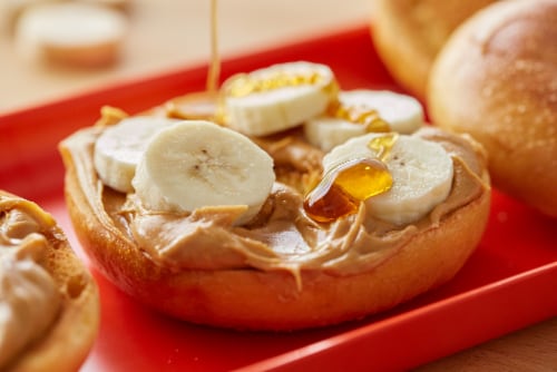 Peter Pan Creamy Honey Roast Peanut Butter Spread Made with Roasted Peanuts Perspective: left