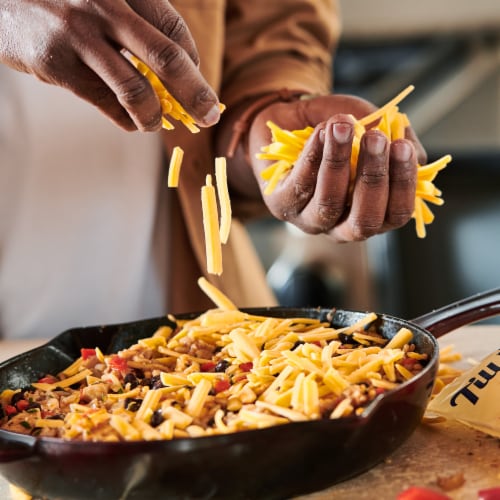 Tillamook Farmstyle Thick Cut Medium Cheddar Shredded Cheese Perspective: left