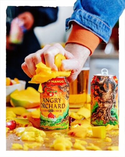 Angry Orchard® Peach Mango Hard Cider Beer Perspective: left
