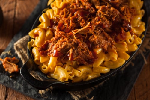 Curly's Bold & Spicy Barbecue Sauce with Pulled Pork Perspective: left