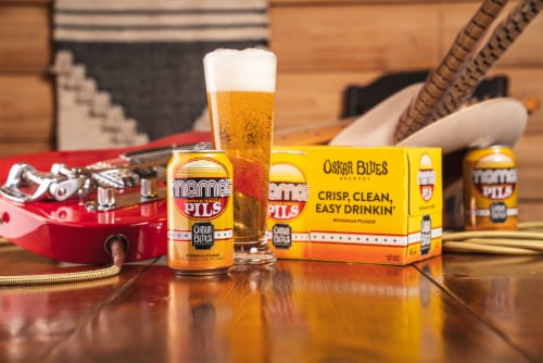 Oskar Blues Mama's Little Yella Pils Bohemian Pilsner Craft Beer Perspective: left