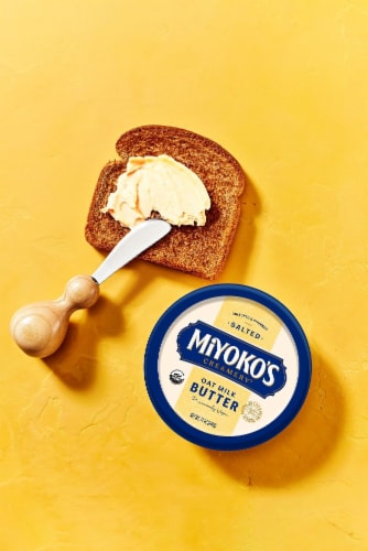 Miyoko's Creamery Organic Hint of Sea Salt Oatmilk and Vegetable Oil Spreadable Vegan Butter Tub Perspective: left