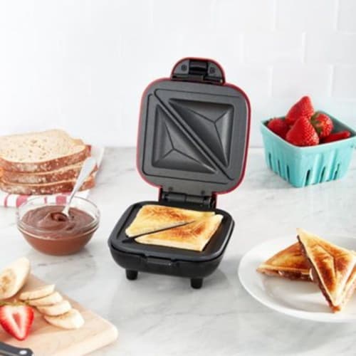 Dash® Pocket Sandwich Maker in Red Perspective: left