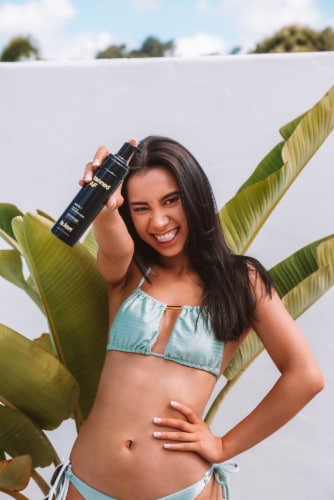 b.tan® Tanned AF Darkest 1 Hour Self Tan Mousse Perspective: left