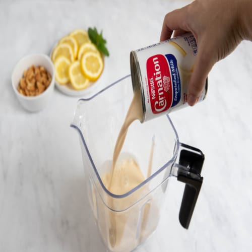 Nestle Carnation Evaporated Milk Vitamin D Added Perspective: right