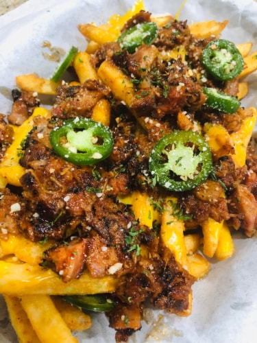 Curly's Bold & Spicy Barbecue Sauce with Pulled Pork Perspective: right