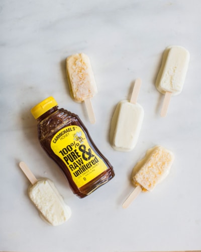 Carmichael's® 100% Pure & Raw Unfiltered Honey Bottle Perspective: right