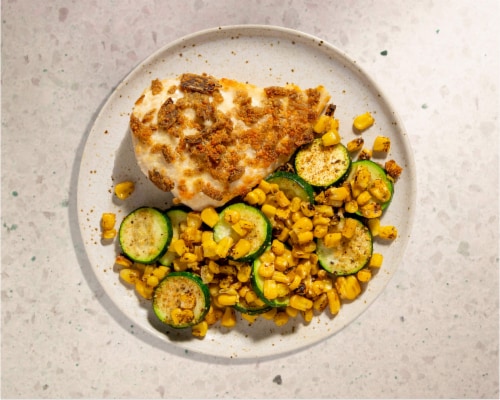 Home Chef Oven Kit Cotija and Jalapeno-Crusted Chicken with Cajun-Style Zucchini and Corn Perspective: top