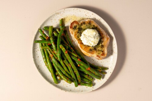 Home Chef Meal Kit Pork Chop With Feta Butter And Roasted Red Pepper Pesto Green Beans Perspective: top
