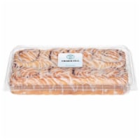 Bakery Fresh Cinnamon Rolls With Drizzled White Icing Perspective: Main