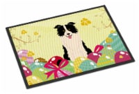 Carolines Treasures BB6118MAT Easter Eggs Border Collie Black White Doormat 18x