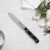 Henckels Solution 5-inch Serrated Utility Knife Perspective: back