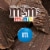 M&M'S Minis Milk Chocolate Easter Basket Candy Mega Tube Perspective: back