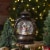 Northlight 8-Inch Black with Brushed Gold LED Snowman and Christmas Trees Snow Globe Lantern Perspective: back