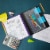 Okuna Outpost Black Spiral Notebook with Folder Pockets, 1/6 Cut Divider Tabs (10 x 11.75 in) Perspective: back