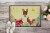 Carolines Treasures BB6137MAT Easter Eggs Bull Terrier Brindle Doormat 18x27 Perspective: back