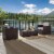 3 Piece Outdoor Seating Set With Gray Cushions - Two Outdoor Chairs & Glass Top Table Perspective: back
