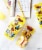 Crunch Pak® Minions Medley With Apple Slices Turkey Sausage Bites & Pretzels Perspective: back