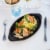 Staub Cast Iron 14.5-inch x 8-inch Covered Fish Pan - Matte Black Perspective: back