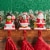 Glitzhome 6.5 Inch Tall Set of Three Resin Santa, Snowman, Penguin Stocking Holder Perspective: back