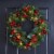 Glitzhome 24 Inch Diameter Berry Magnolia Leaf Pinecone Wreath With Lights Perspective: back