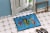 Carolines Treasures 8713JMAT Troical Fish and Seaweed on Blue Doormat 24x36 Perspective: bottom