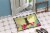 Carolines Treasures BB6028MAT Easter Eggs Manchester Terrier Doormat 18x27 Perspective: bottom