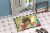 Carolines Treasures BB6102MAT Easter Eggs Pekingese Tan Doormat 18x27 Perspective: bottom