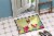 Carolines Treasures BB6137MAT Easter Eggs Bull Terrier Brindle Doormat 18x27 Perspective: bottom