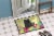 Carolines Treasures BB6143MAT Easter Eggs Chow Chow Black Doormat 18x27 Perspective: bottom