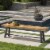 Cana Outdoor Teak Finished Acacia Wood Bench with Rustic Metal Accents Perspective: front