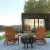 3 Piece Charlestown Teak Poly Resin Wood Adirondack Chair Set with Fire Pit - Star and Moon Perspective: front