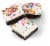 Bakery Fresh Goodness Iced Brownies With Rainbow Sprinkles Perspective: left